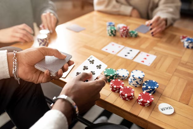 Live dealer revealing community cards in Casino Hold'em game